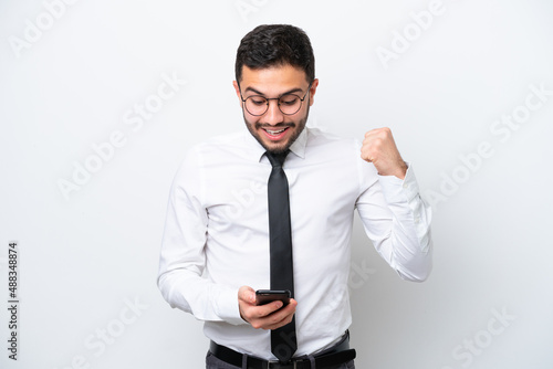 Business Brazilian man isolated on white background surprised and sending a message