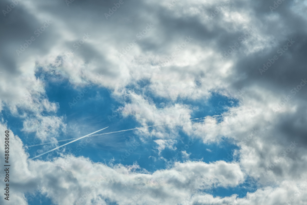 white clouds in the blue sky with jet plane white clouds in the blue sky with jet plane