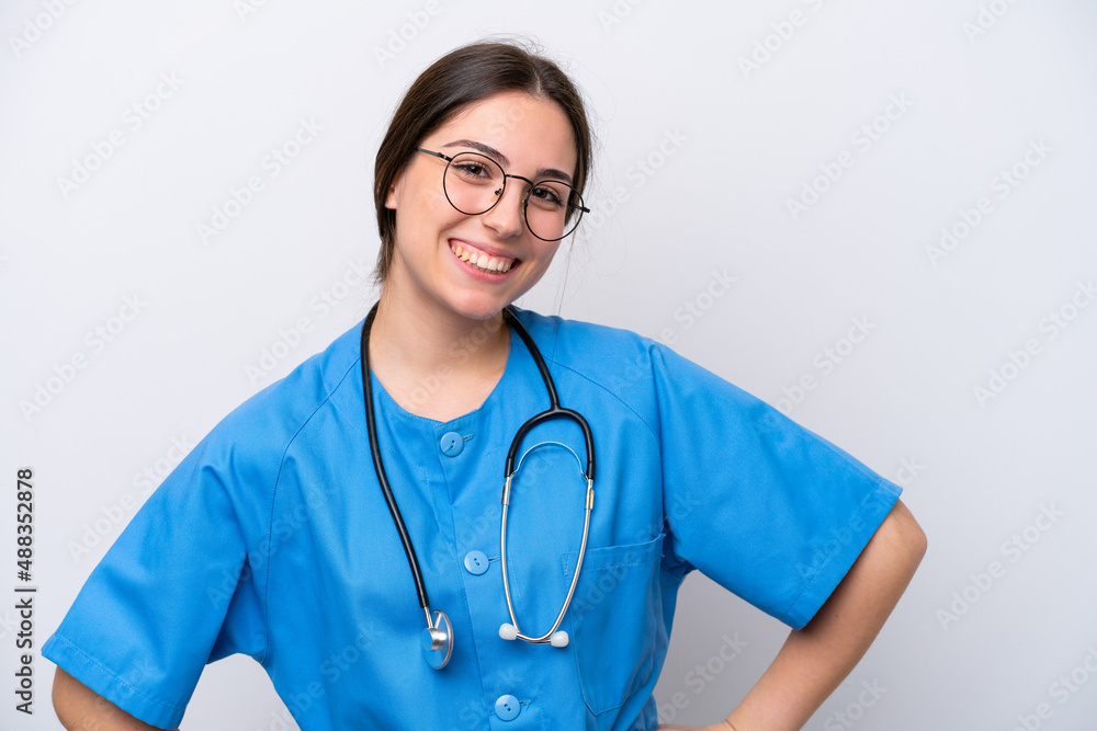 surgeon doctor woman holding tools isolated on white background posing with arms at hip and smiling surgeon doctor woman holding tools isolated on white background posing with arms at hip and smiling
