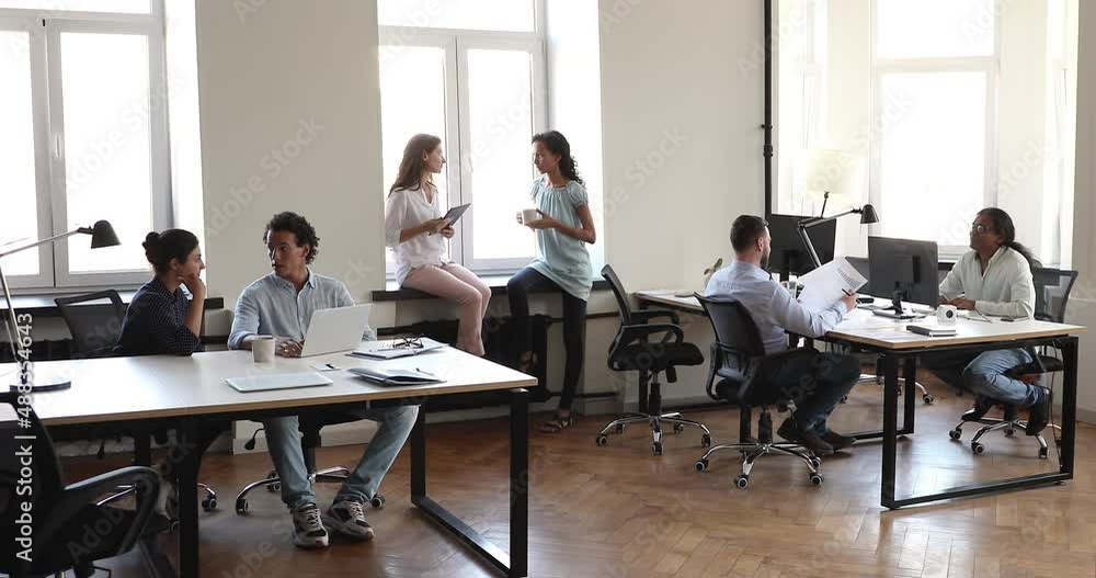 Six diverse staff members working in spacious co-working space room, communicate, solve business, discuss collaborative project. Busy workday in modern coworking office, cooperation, teamwork concept. Six diverse staff members working in spacious co-working space room, communicate, solve business, discuss collaborative project. Busy workday in modern coworking office, cooperation, teamwork concept.