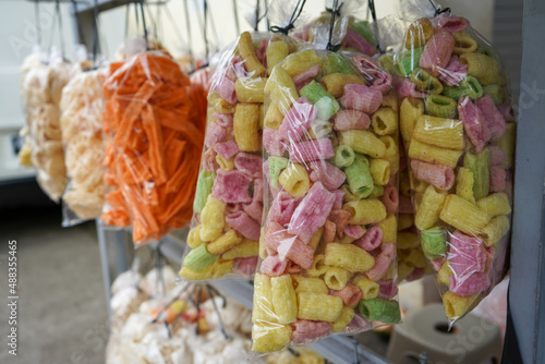 Krupuk , kerupuk , keropok , kroepoek or kropek is a cracker made from starch or animal skin and other ingredients that serve as flavouring. Most krupuk are deep fried, while some others are grilled. photo