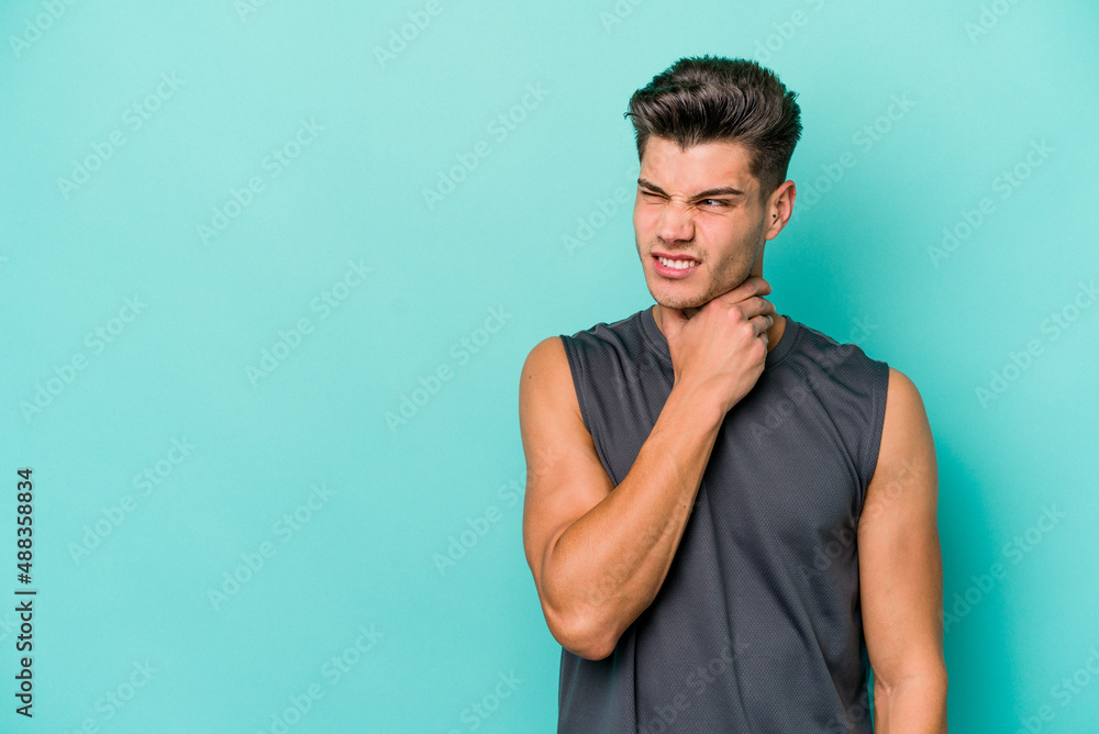 Young caucasian man isolated on blue background touching back of head, thinking and making a choice. Young caucasian man isolated on blue background touching back of head, thinking and making a choice.