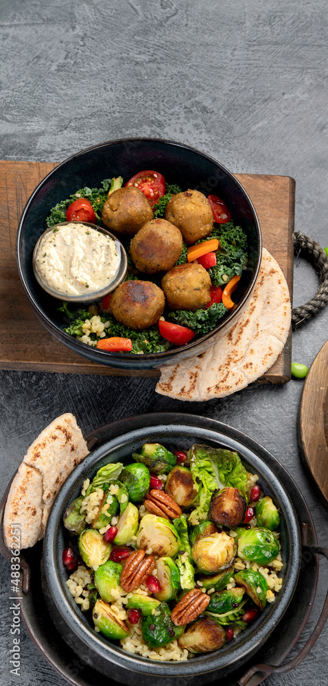 Brussel sprout salad with bulgur on dark background. Brussel sprout salad with bulgur on dark background.