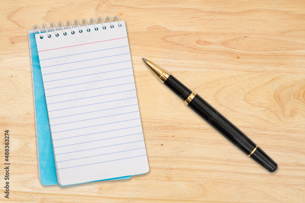 Blank retro lined paper notepad with a pen Blank retro lined paper notepad with a pen