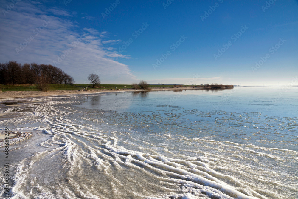 View over the frozen lake IJsselmeer