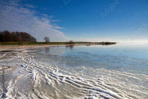 View over the frozen lake IJsselmeer photo