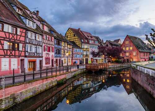 Fototapeta Naklejka Na Ścianę i Meble -  Sightseeing of France. Amazing colorful traditional half timbered houses in Colmar old town, beautiful night view, Colmar, Alsace, France