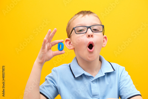 speech therapy, the boy learns to pronounce sounds and words correctly