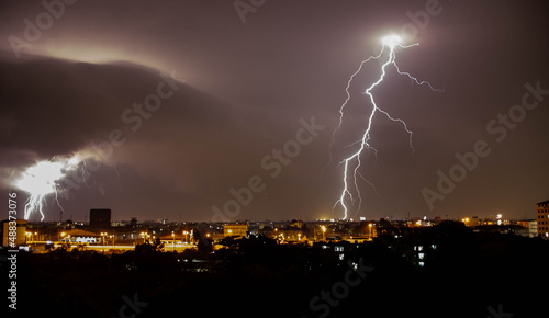 thunderstorm over the city in the night time