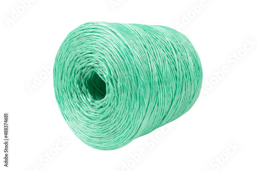 Coiled nylon rope isolated on white background. Green rolled  striped nylon rope isolated. A coil of new colored rope.