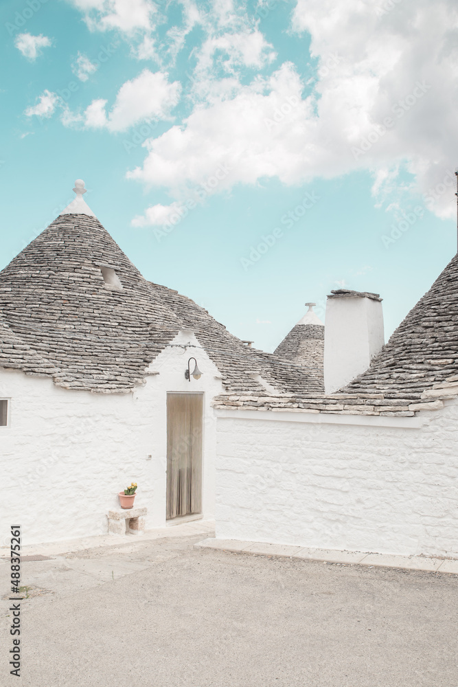 South Italy in summer. Alberobello, a wonderful apulian village with typical houses called trulli 