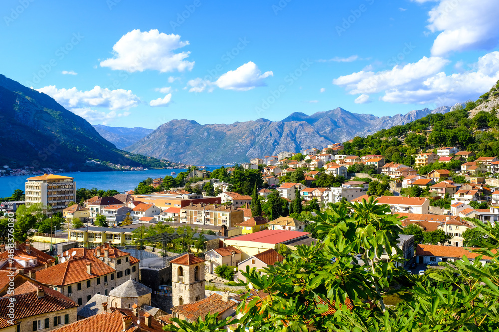 Fototapeta premium Kotor Montenegro. Boko Kotor Bay panoramic view. Beautiful summer day with blue sky and clouds.