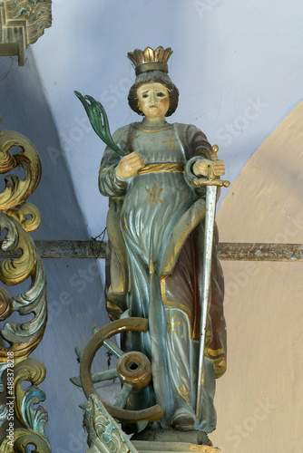 Saint Catherine of Alexandria, statue on the altar of Saint Anthony the Hermit in the parish church of Saint Peter in Petrovina, Croatia photo