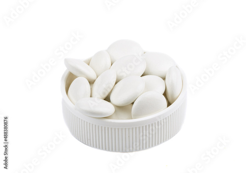 Medical pills in a plastic cap isolated on a white background.