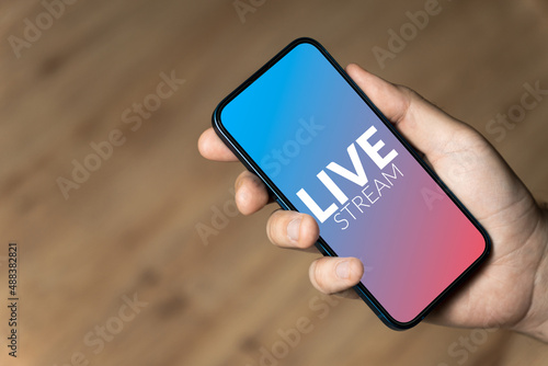 Live Stream - hand holding a phone
