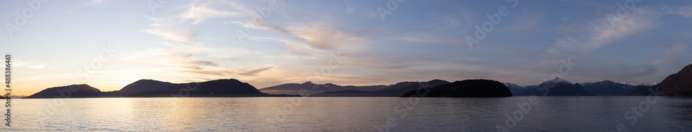 Panoramic View of Canadian Nature Mountain Landscape on the Pacific Ocean West Coast. Colorful Winter Sunset. Taken in Howe Sound near Horseshoe Bay, West Vancouver, BC, Canada. Background Panorama