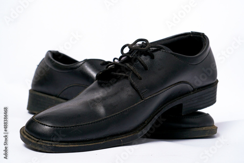 Formal black shoes for men to look more elegant, with a white background
