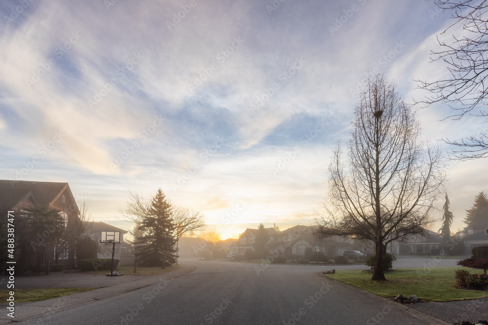 Fraser Heights, Surrey, Greater Vancouver, BC, Canada. Beautiful Street view in the Residential Neighborhood during a colorful Winter Season. Dramatic Sunrise Sky.