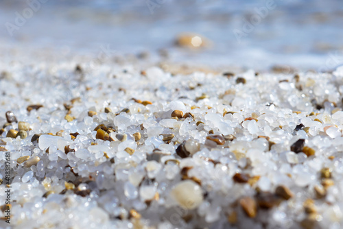 Close up of salt background. Natural salt. Dead Sea salt mineral natural formations. Salt crystals from Dead sea. View of Dead Sea coastline. Texture of Dead sea. Salty seashore rocks