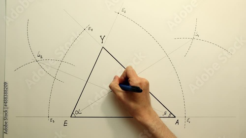 Young mathematician hand marks incenter of a triangle. Date of shooting day 26 January 2022 year, MSK time. This video was filmed in Russia. photo