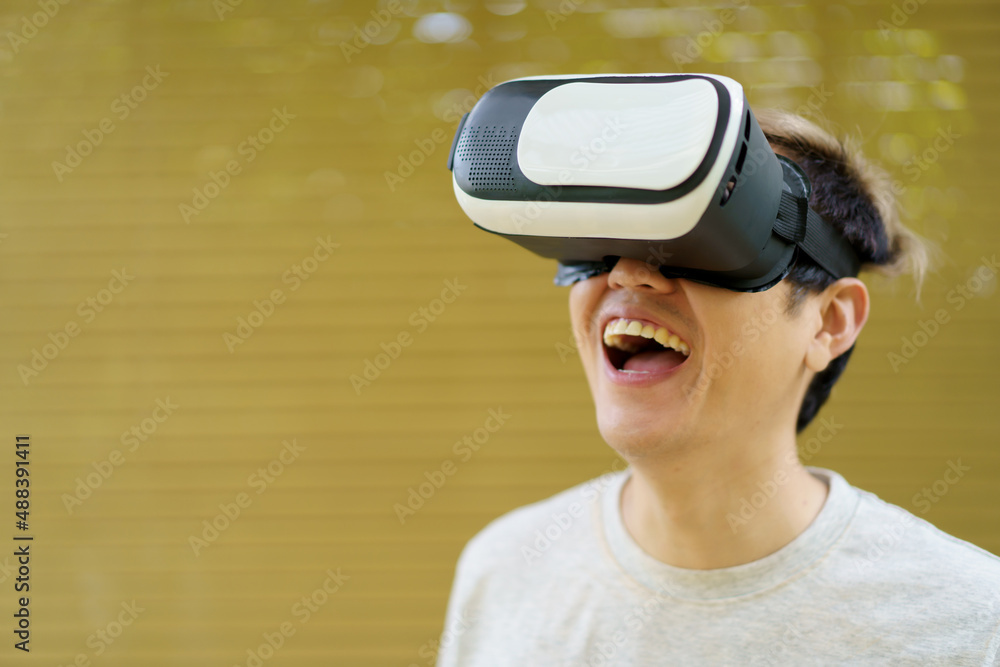 Active Asian sportsman doing a weight training exercise by using dumbbell and virtual reality - VR. Active Asian sportsman doing a weight training exercise by using dumbbell and virtual reality - VR.