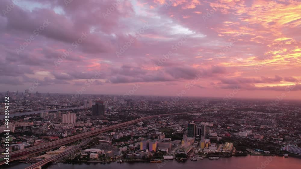 Aerial view, Hyperlapse drone aerial view of Towers business area on a sunny evening. Timelapse during sunset on city scape Aerial view, Hyperlapse drone aerial view of Towers business area on a sunny evening. Timelapse during sunset on city scape