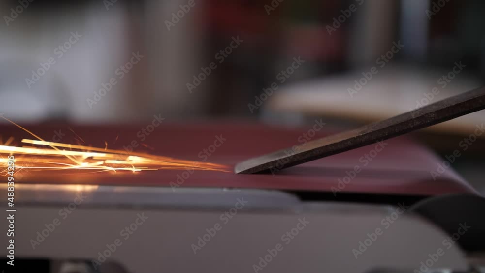 sparks from using belt sander to sharpening chisel slow motion 4k sparks from using belt sander to sharpening chisel slow motion 4k