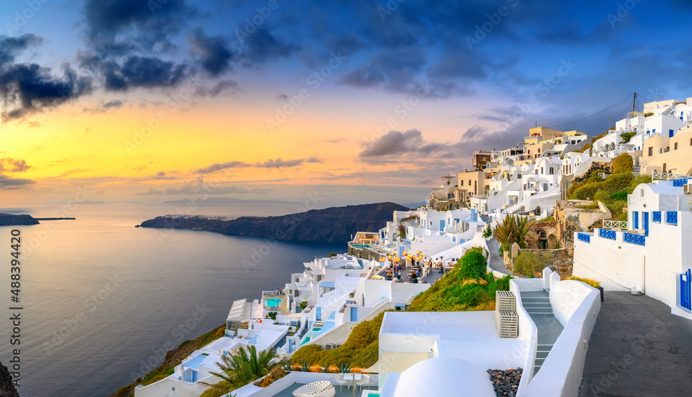 Fantastic sunset on famous view over greek resort Fira, Greece, Europe. luxury travel. famous travel landscape. Summer holidays. Travel concept background.