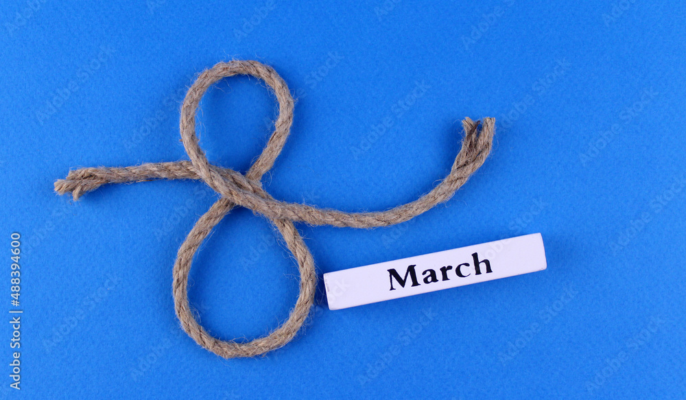 March 8 from a rope on a blue background
