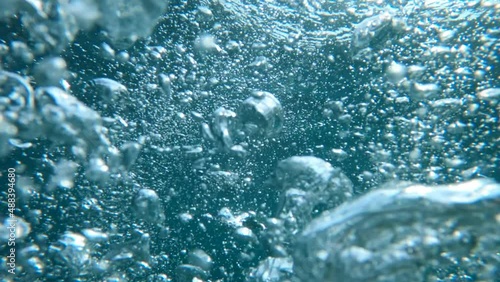 Underwater bubbles as abstract background in slow motion