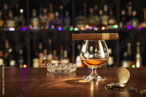 close up view of cigar and glass of whiskey on color back.  © Dmitry Ersler