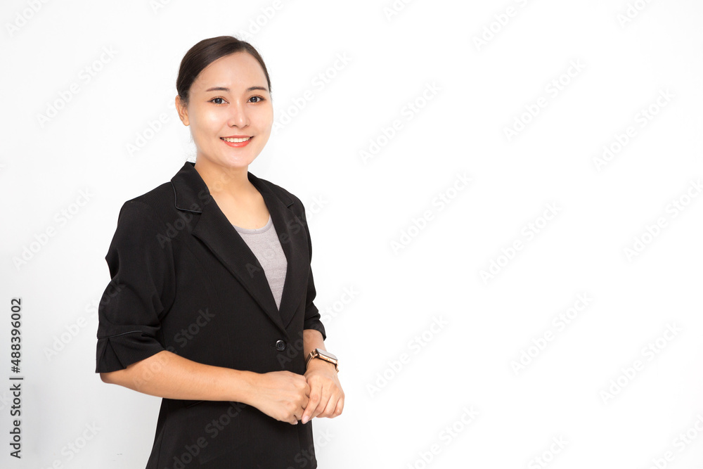 Beautiful Asian business woman wearing black suit with holding her hand on white background and copy space. Confident Asian working woman smiling and cheerful Beautiful Asian business woman wearing black suit with holding her hand on white background and copy space. Confident Asian working woman smiling and cheerful