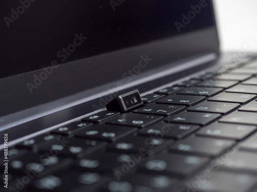 Close-up of the laptop camera built into the keyboard. Modern unusual solutions in laptops. Selective focus
