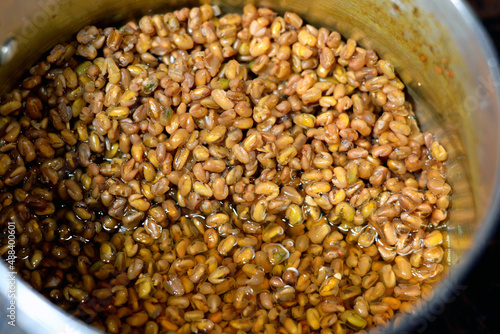 Selective focus of boiled fenugreek seeds in water that is believed to have great medicinal benefits in traditional and alternative medicine, used as a herb and spices, Methi Dana drink photo