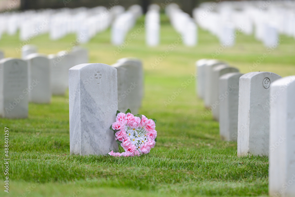 Headstones and flowers in Arlington National Cemetery - Circa Washington D.C. United States of America	
