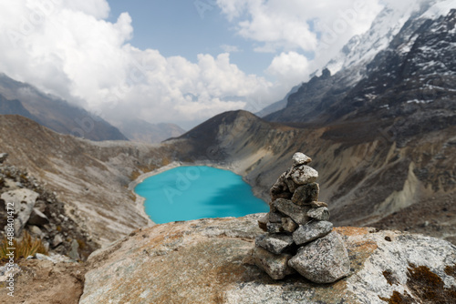 Hidden crystal clear blue lake along the top of Salkantay trek (Inka Trail alternative) from Cusco to Machu Picchu in the Peruvian Andes (Peru, South America) photo