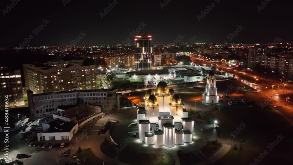 Panoramic areal view of city centre at night, Lviv, Ukraine. Above view from drone on church and bell tower at night with houses and buildings on background. Concept of night city Panoramic areal view of city centre at night, Lviv, Ukraine. Above view from drone on church and bell tower at night with houses and buildings on background. Concept of night city