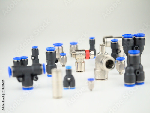 Various brass and plastic pneumatic components as macro wit blur photo