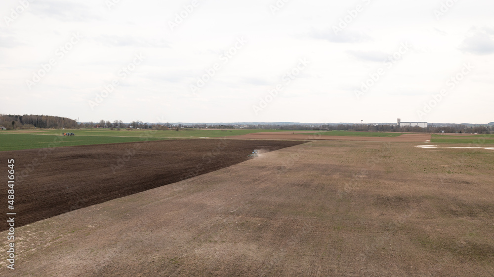 Partly Plowed Farm field in the Spring farming Season