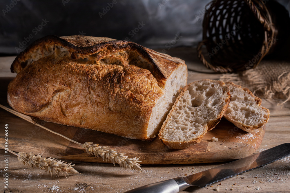 White wheat sliced bread on a wooden table White wheat sliced bread on a wooden table