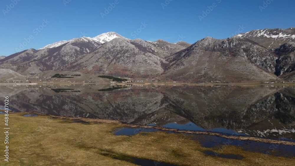 Smooth panorama of the snowy mountains in the lake. South of Italy, Lake Matese view from drone 4K Smooth panorama of the snowy mountains in the lake. South of Italy, Lake Matese view from drone 4K