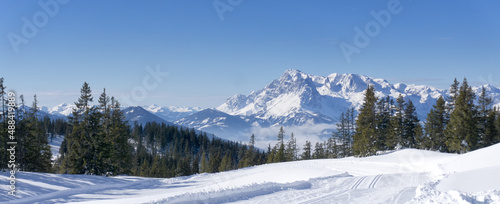 Wide scenic mountain panorama during wintertime in Salzburg Alps, Austria, Europe. View from Rossbrand mountain on valley and surrounding countryside.