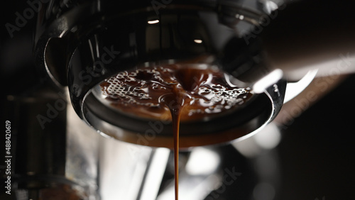closeup shot of espresso extraction with bottomless portafilter photo