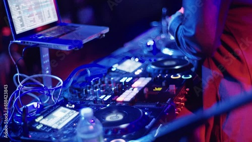 Handheld Shot of DJ Mixing