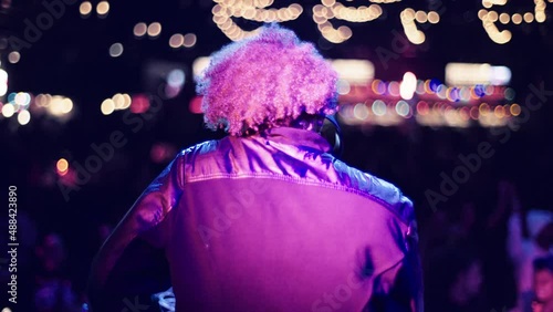 Handheld Shot of DJ Performing in Front of Crowd