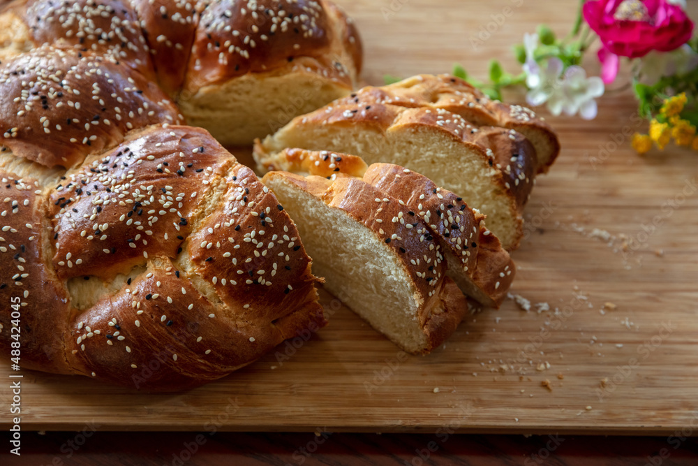 Easter sweet bread, greek tsoureki, brioche braid slice on table, close up view Easter sweet bread, greek tsoureki, brioche braid slice on table, close up view
