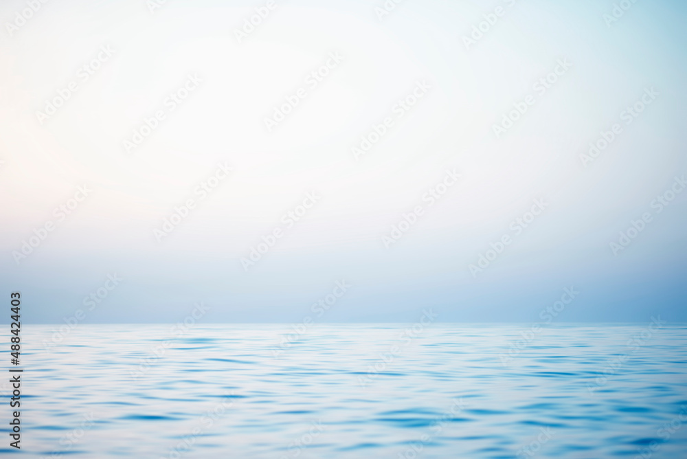 Abstract sunset sky and ocean nature background with blurred panning motion. Abstract sunset sky and ocean nature background with blurred panning motion.