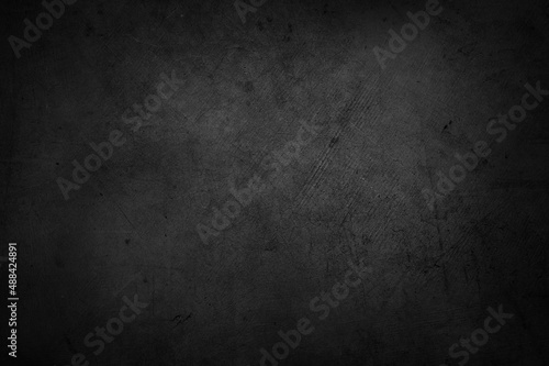 Empty black textured concrete wall background