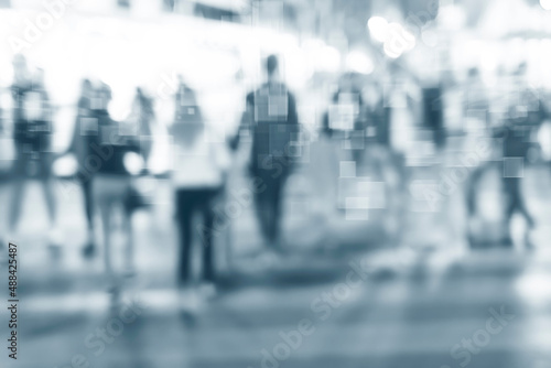 filtered blur abstract people background, unrecognizable silhouettes of people walking on a street © malija