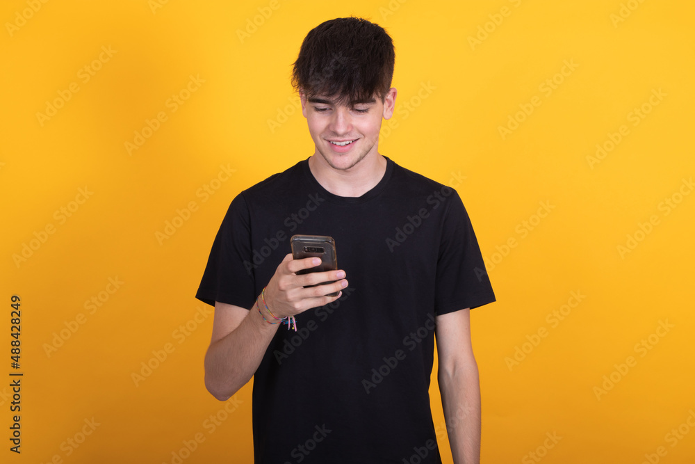 isolated teen boy with mobile or cell phone isolated teen boy with mobile or cell phone